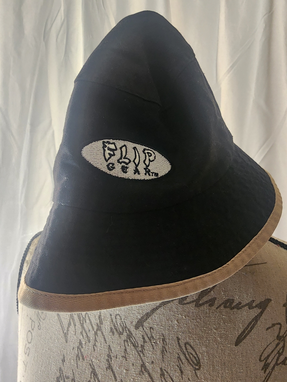 Magic Brand Flip Gear Patch Black Bucket Hat with Tan Trim and Embroidered Patch